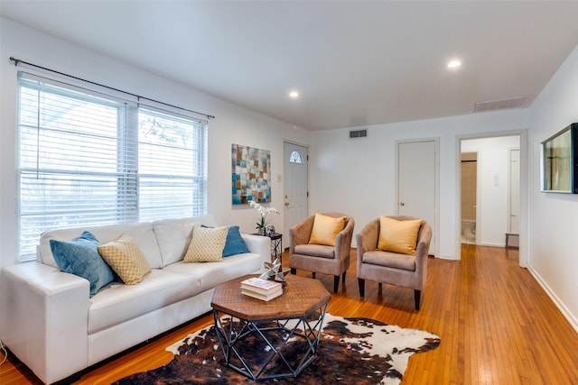 living room with light hardwood / wood-style floors