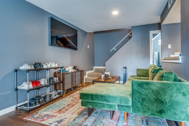 living room featuring dark wood-type flooring