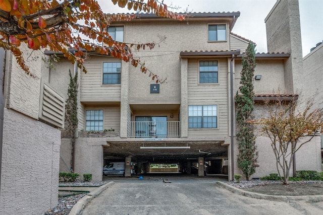 view of front of house featuring a balcony