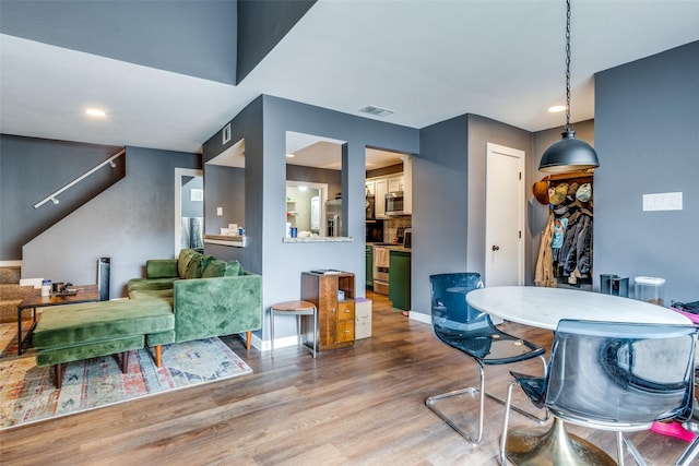 dining area with wood-type flooring