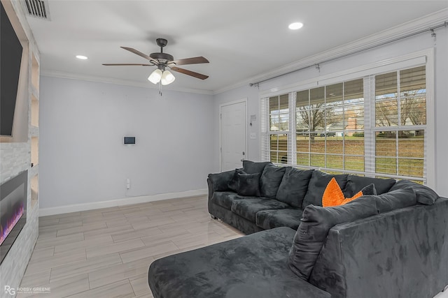 living room with ceiling fan, crown molding, and light hardwood / wood-style flooring