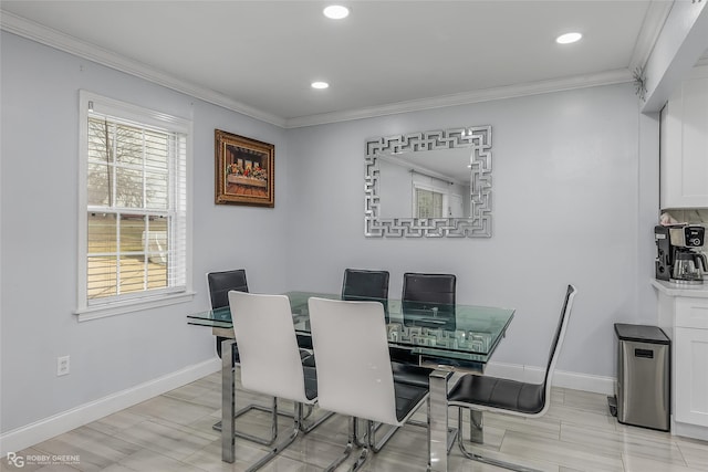 dining area featuring crown molding