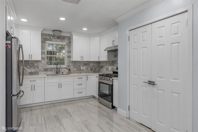 kitchen with white cabinetry, sink, stainless steel appliances, and ornamental molding