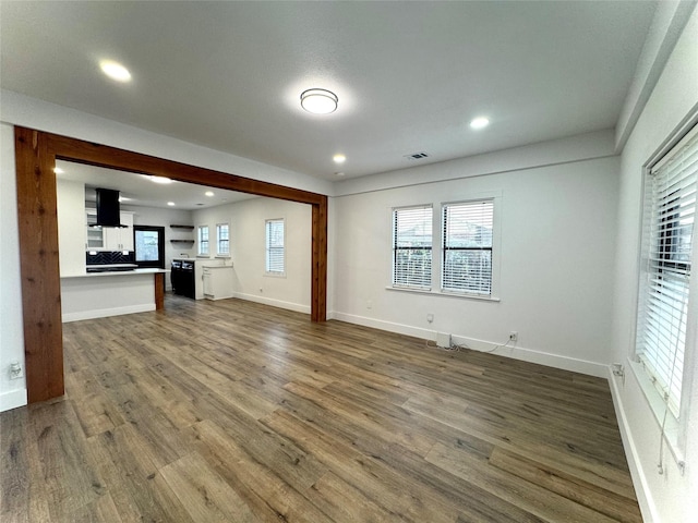 unfurnished living room with hardwood / wood-style floors