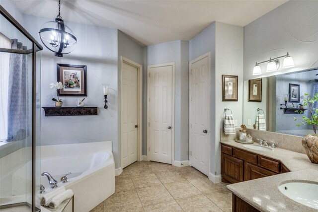 bedroom with ensuite bathroom, light tile patterned flooring, lofted ceiling, and a chandelier