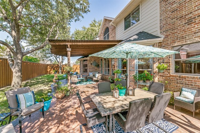 view of patio featuring an outdoor living space with a fire pit