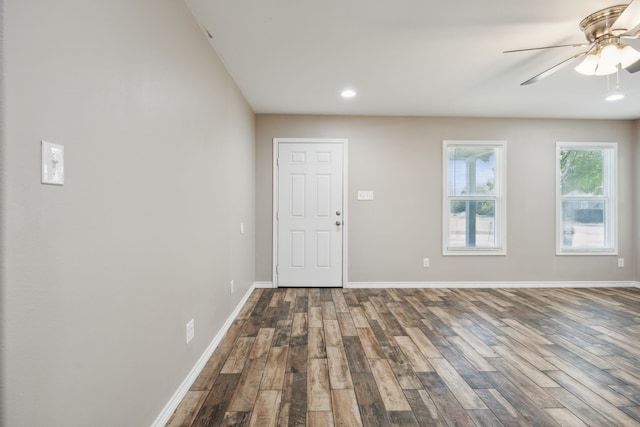 empty room featuring ceiling fan and hardwood / wood-style floors