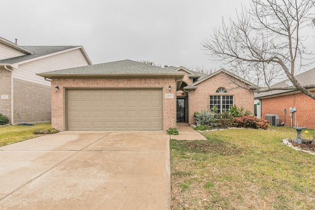 single story home with a garage, central air condition unit, and a front yard