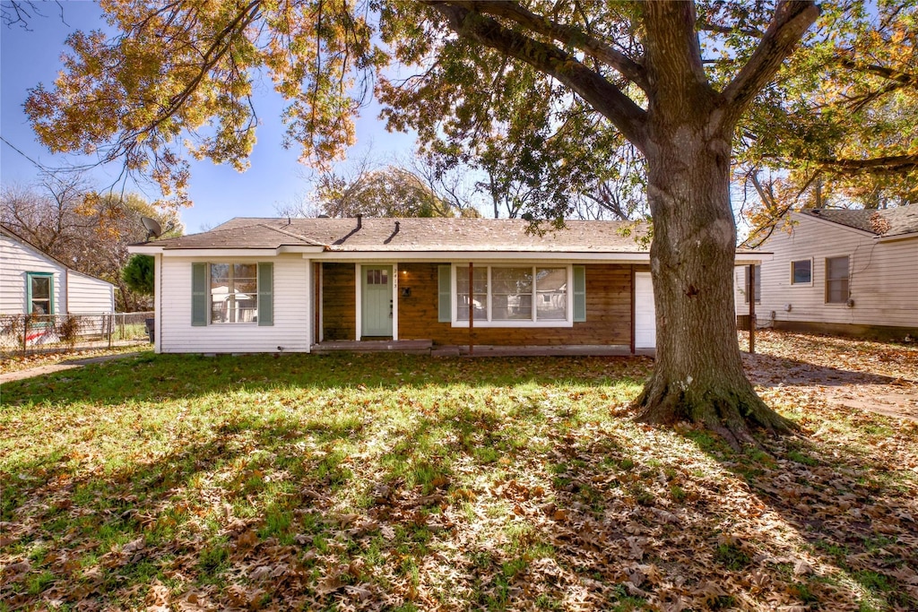 ranch-style house with a front lawn