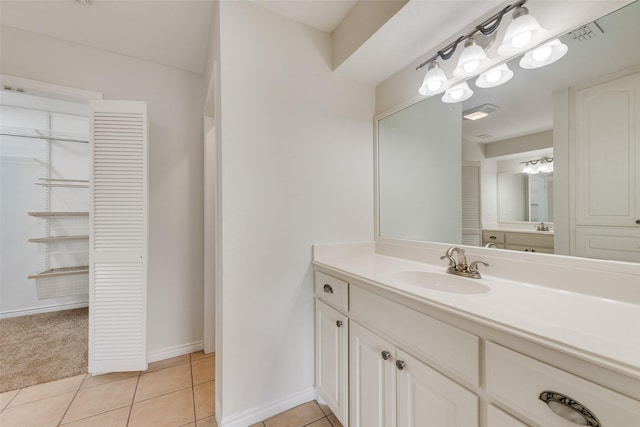 bathroom with tile patterned floors and vanity