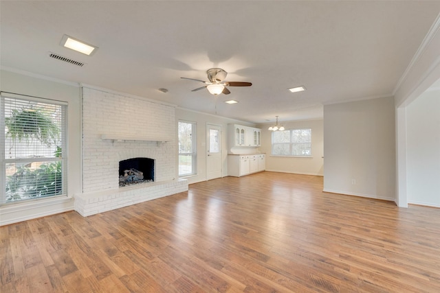 unfurnished living room featuring hardwood / wood-style floors and a healthy amount of sunlight