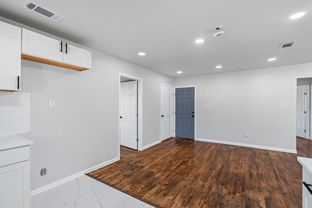 spare room with dark hardwood / wood-style floors