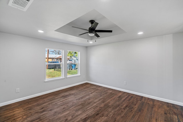 unfurnished room featuring dark hardwood / wood-style floors and ceiling fan