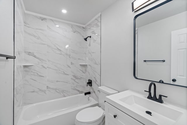 full bathroom featuring vanity, toilet, tiled shower / bath, and crown molding