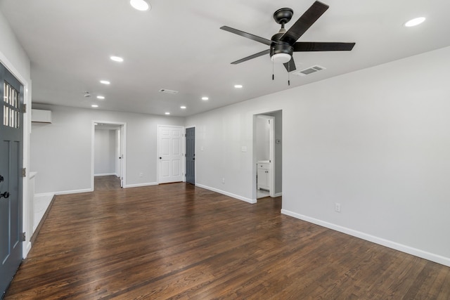 spare room featuring dark hardwood / wood-style floors and ceiling fan