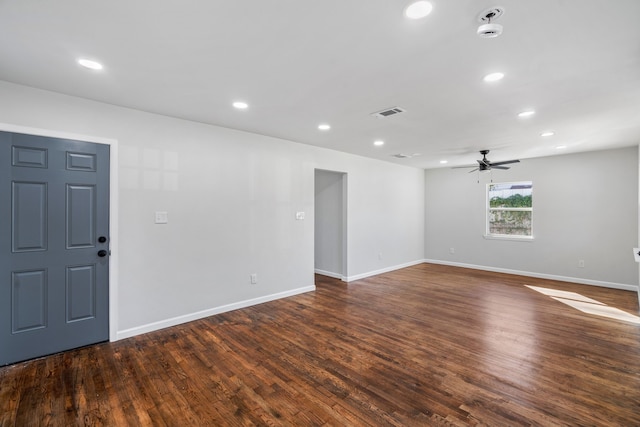 empty room featuring dark hardwood / wood-style floors and ceiling fan