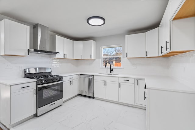 kitchen featuring sink, white cabinets, stainless steel appliances, and wall chimney range hood