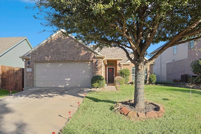 view of front facade featuring a garage and a front yard