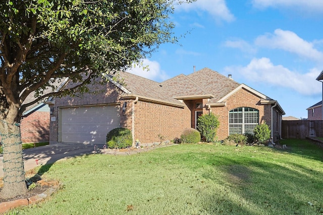 ranch-style house featuring a front lawn and a garage