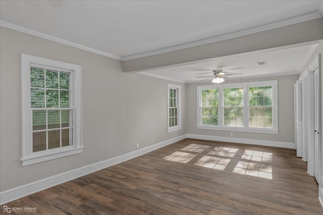 unfurnished room featuring hardwood / wood-style floors, a wealth of natural light, and crown molding