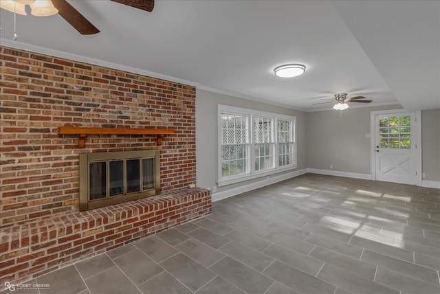 unfurnished living room with a fireplace, ceiling fan, and ornamental molding