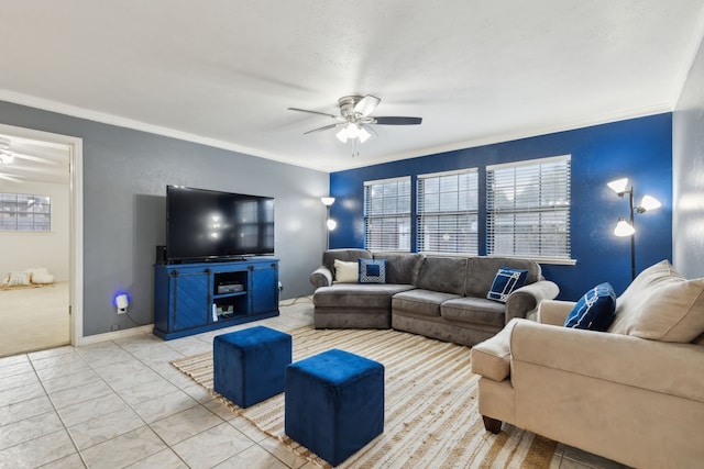 living room with ceiling fan and ornamental molding