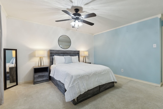 carpeted bedroom featuring ceiling fan and ornamental molding