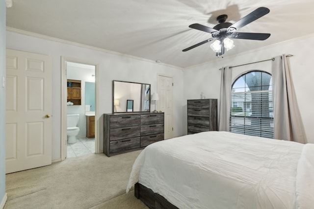 carpeted bedroom with connected bathroom, ceiling fan, and ornamental molding