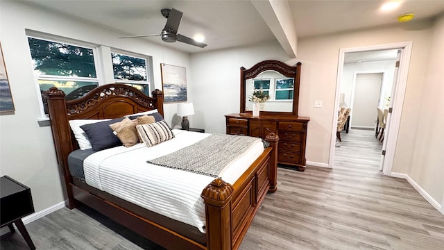 bedroom featuring ceiling fan and light hardwood / wood-style flooring