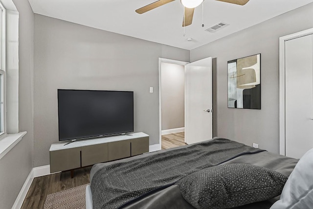 bedroom featuring wood-type flooring and ceiling fan