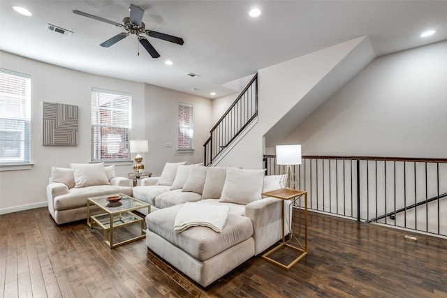 living room with ceiling fan, dark hardwood / wood-style flooring, and a wealth of natural light