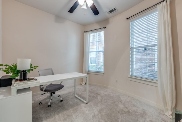 office area with light colored carpet and ceiling fan