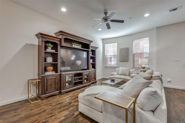 living room featuring dark hardwood / wood-style floors and ceiling fan