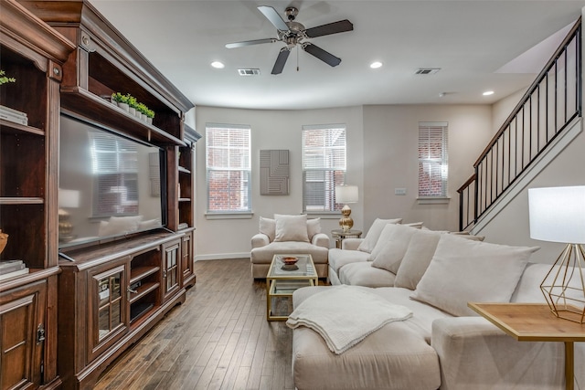 living room with ceiling fan and dark hardwood / wood-style floors