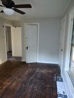 spare room with dark hardwood / wood-style floors and ceiling fan