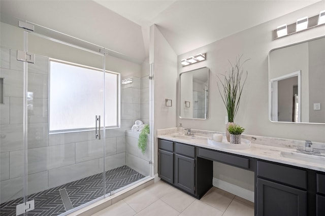 bathroom featuring tile patterned floors, vanity, and a shower with shower door