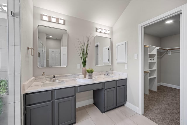 bathroom with tile patterned floors and vanity