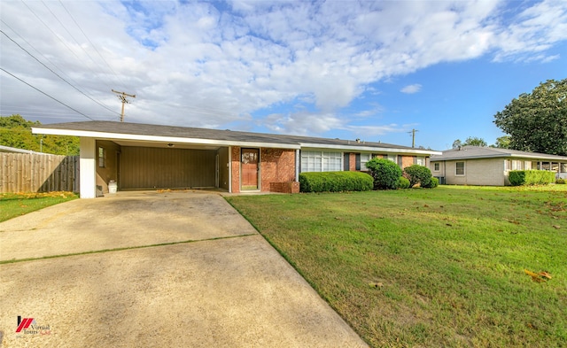 ranch-style house featuring a front yard and a carport