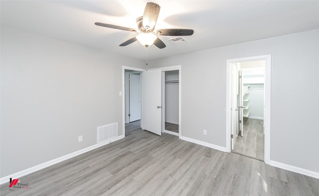 unfurnished bedroom with ceiling fan and light hardwood / wood-style floors