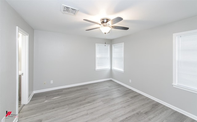 spare room with ceiling fan and light hardwood / wood-style flooring