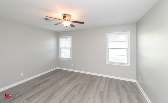 spare room with light hardwood / wood-style floors and ceiling fan