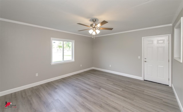 empty room with light wood-type flooring, ceiling fan, and crown molding