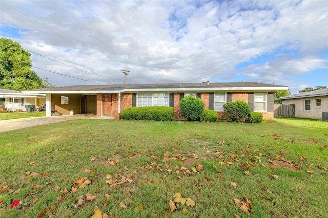 ranch-style house with a front lawn and a carport