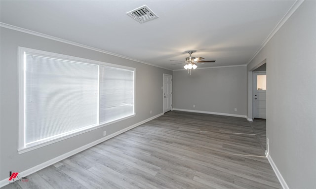 unfurnished room with hardwood / wood-style flooring, ceiling fan, and ornamental molding