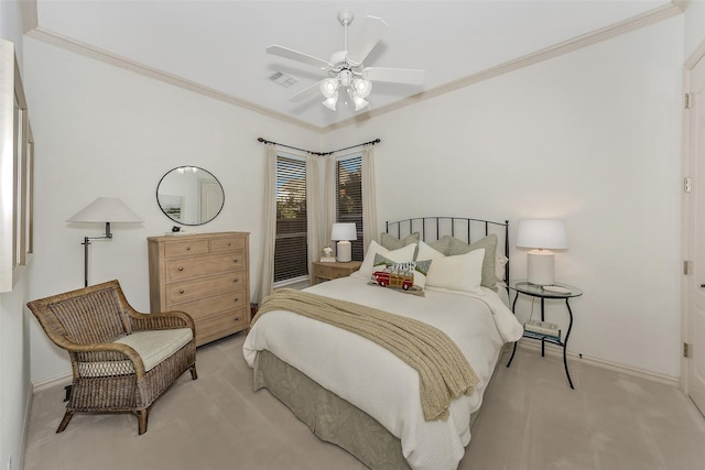 carpeted bedroom featuring ornamental molding and ceiling fan