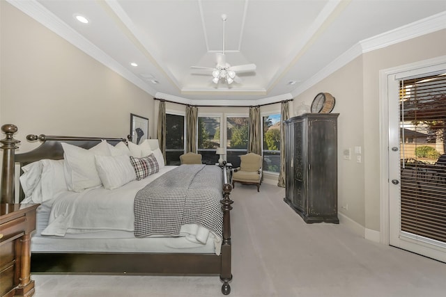 carpeted bedroom with a raised ceiling, crown molding, access to exterior, and ceiling fan