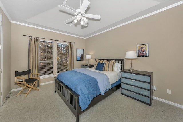 bedroom featuring ornamental molding, light colored carpet, and ceiling fan