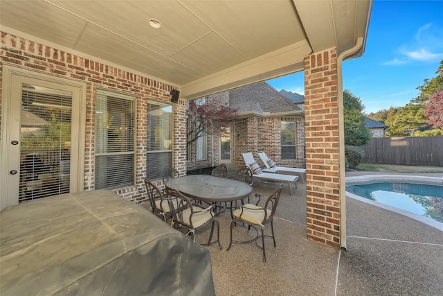 view of patio with a fenced in pool