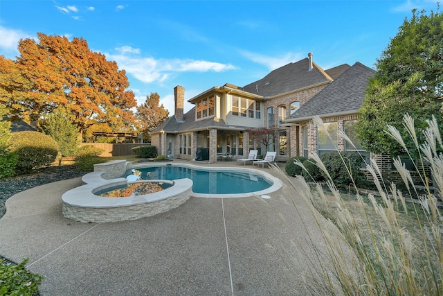 view of pool featuring a patio and an outdoor fire pit