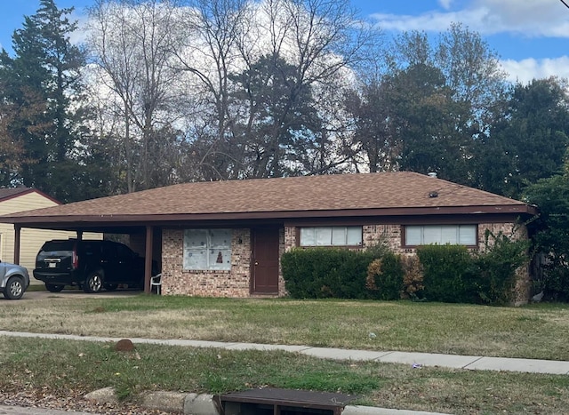 single story home featuring a carport and a front yard